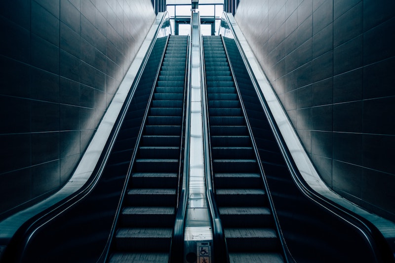 A pair of escalators in a dark location
