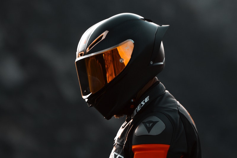 Motorcyclist with a black helmet