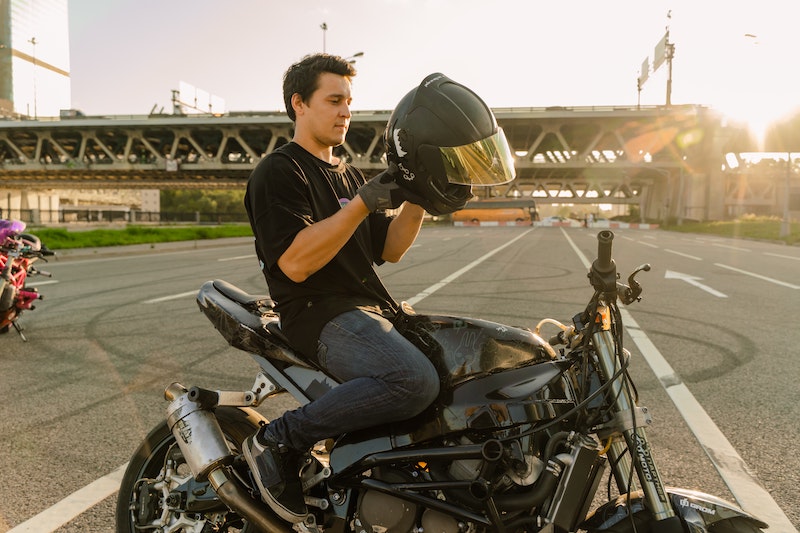 Motorcyclist with a black helmet