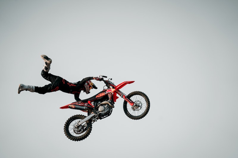 Motorcyclist in the air doing a stunt